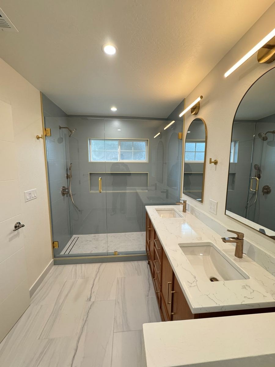 Primary bathroom remodel with walk-in shower and quartz double vanity